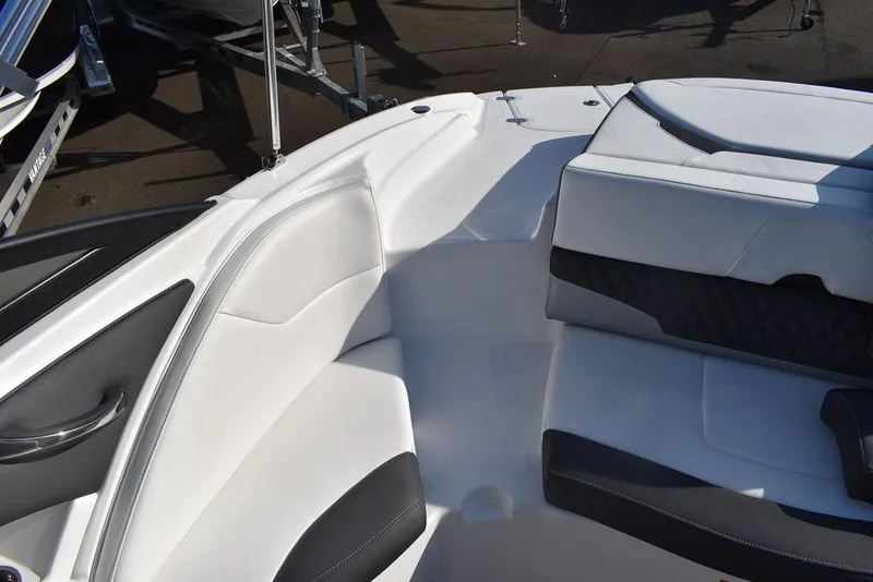 Slide: The Image of 2024 Monterey 224FS boat interior with white and black seating. - 30