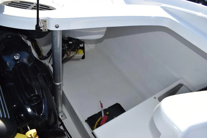 Slide: The Image of 2024 Monterey 224FS boat engine compartment with battery and wiring. - 37