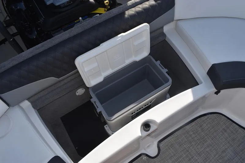 Slide: The Image of 2024 Monterey 224FS boat with open storage compartment and cooler. - 41