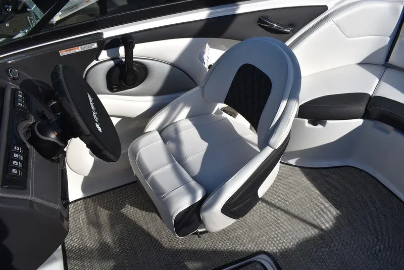 Slide: The Image of 2024 Monterey 224FS boat interior with captain's chair and steering wheel. - 45