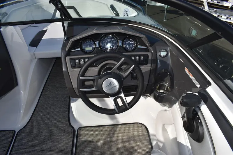 Slide: The Image of 2024 Monterey 224FS boat cockpit with steering wheel and instrument panel. - 47