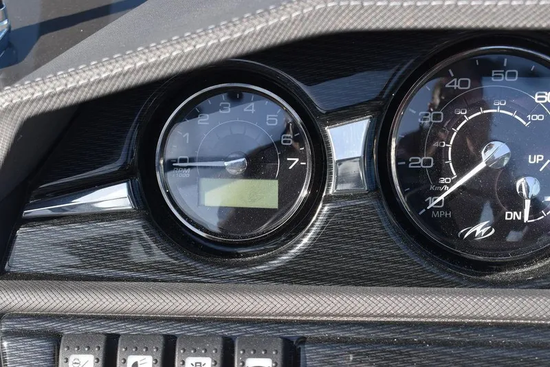 Slide: The Image of Close-up of 2024 Monterey 224FS boat dashboard gauges and controls. - 49