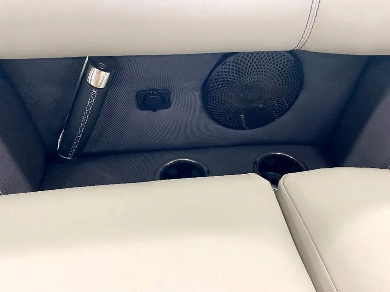 Slide: The Image of 2024 Barletta Lusso Ultra-Lounge L25U interior, featuring speaker, cup holders, and USB port. - 14