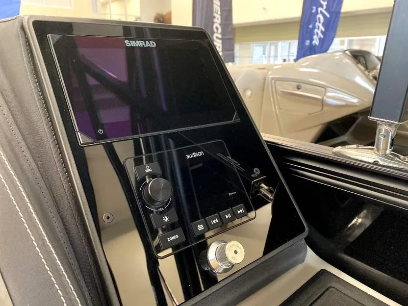 Slide: The Image of 2024 Barletta Lusso Ultra-Lounge L25U dashboard with Simrad display and audio controls. - 21