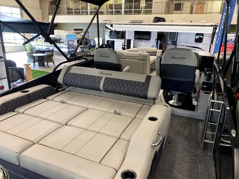 Slide: The Image of 2024 Barletta Lusso Ultra-Lounge L25U luxury pontoon boat interior with plush seating. - 3