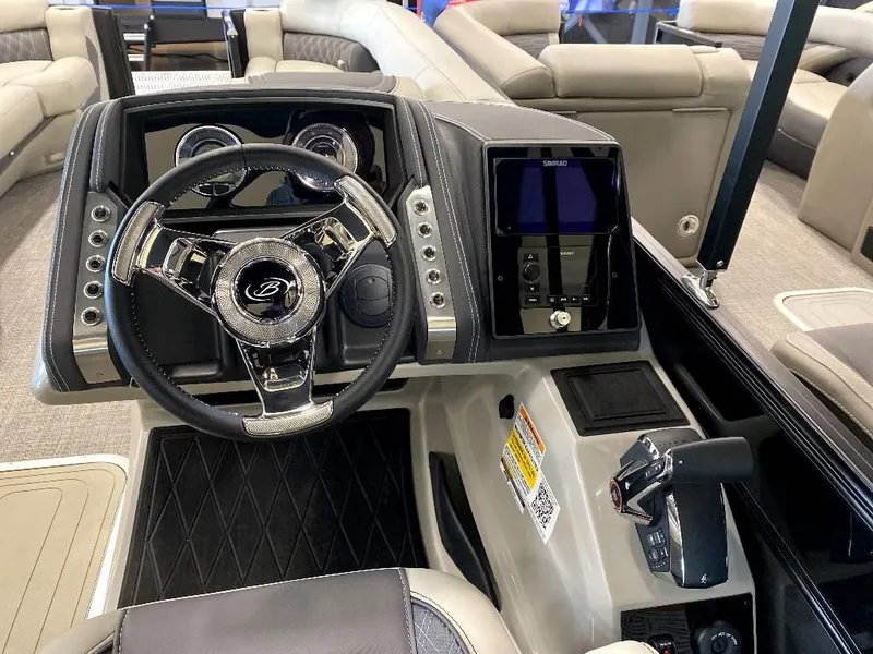 Slide: The Image of 2024 Barletta Lusso Ultra-Lounge L25U boat dashboard with steering wheel and control panel. - 5
