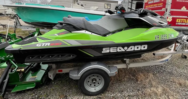 Slide: The Image of 2017 Bombardier Sea Doo GTR 230 jet ski in vibrant green on a trailer. - 16
