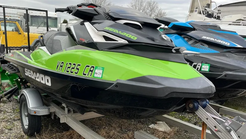 Slide: The Image of 2017 Bombardier Sea Doo GTR 230 jet ski in vibrant green on trailer. - 18