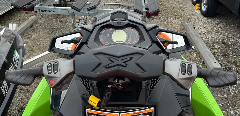 Slide: The Image of 2017 Bombardier Sea Doo GTR 230 dashboard and controls, featuring mirrors and handlebars. - 19