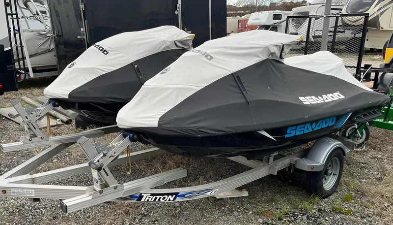 Slide: The Image of Two covered 2017 Bombardier Sea Doo GTR 230 jet skis on Triton trailers. - 21