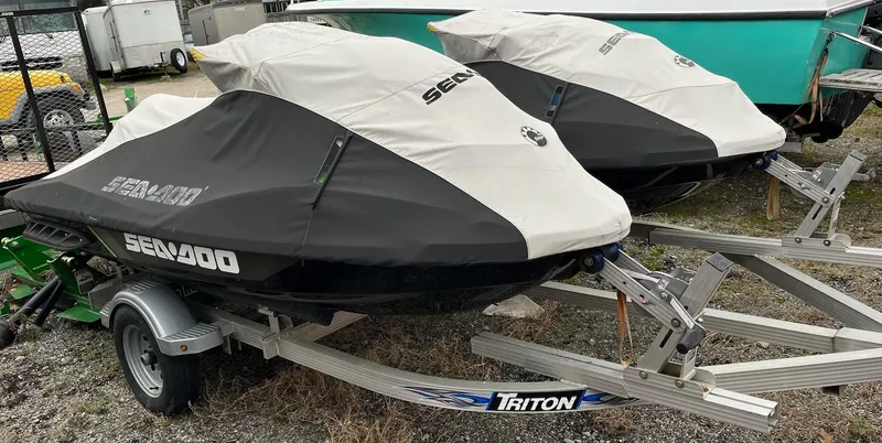 Slide: The Image of 2017 Bombardier Sea Doo GTR 230 jet skis covered on Triton trailers. - 22