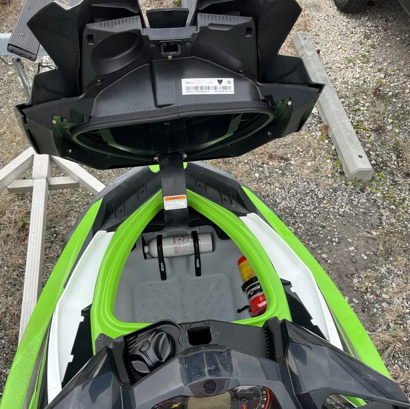 Slide: The Image of 2017 Bombardier Sea Doo GTR 230 storage compartment open, revealing interior details. - 23