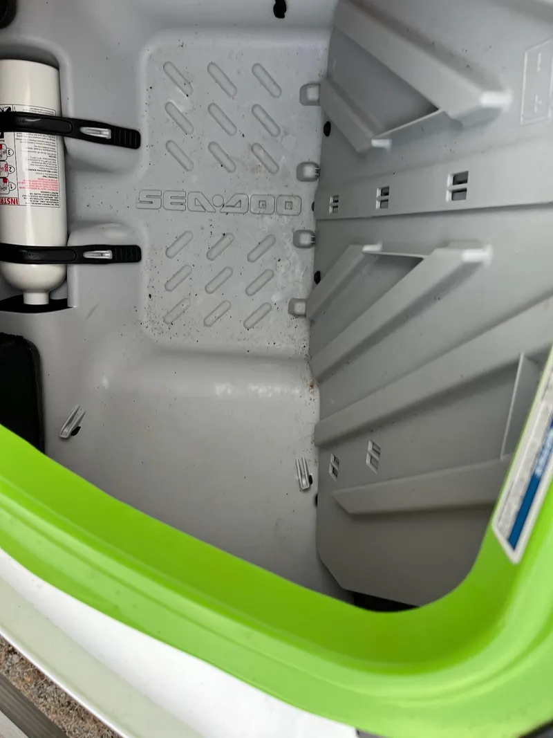 Slide: The Image of Storage compartment of a 2017 Bombardier Sea Doo GTR 230 with fire extinguisher. - 25