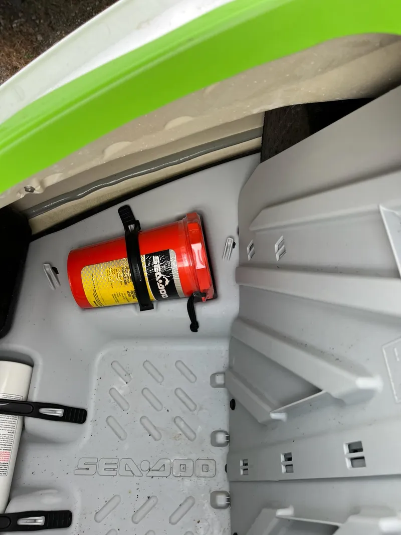 Slide: The Image of 2017 Bombardier Sea Doo GTR 230 storage compartment with safety equipment. - 26