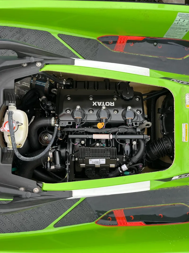 Slide: The Image of 2017 Bombardier Sea Doo GTR 230 engine compartment, featuring Rotax engine components. - 28