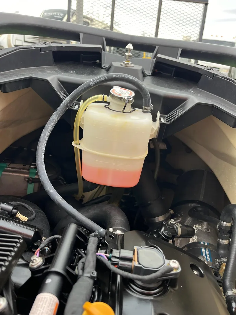 Slide: The Image of Engine compartment of a 2017 Bombardier Sea Doo GTR 230 with visible coolant reservoir. - 31