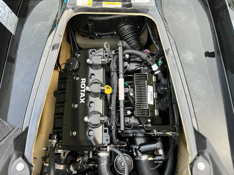 Slide: The Image of 2017 Bombardier Sea Doo GTR 230 engine compartment with Rotax engine components. - 34