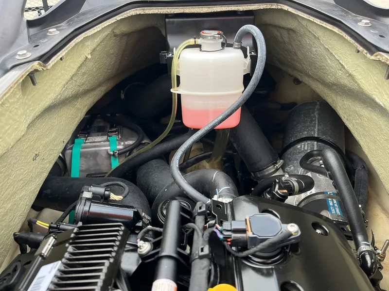 Slide: The Image of Engine compartment of a 2017 Bombardier Sea Doo GTR 230 with visible coolant reservoir. - 35