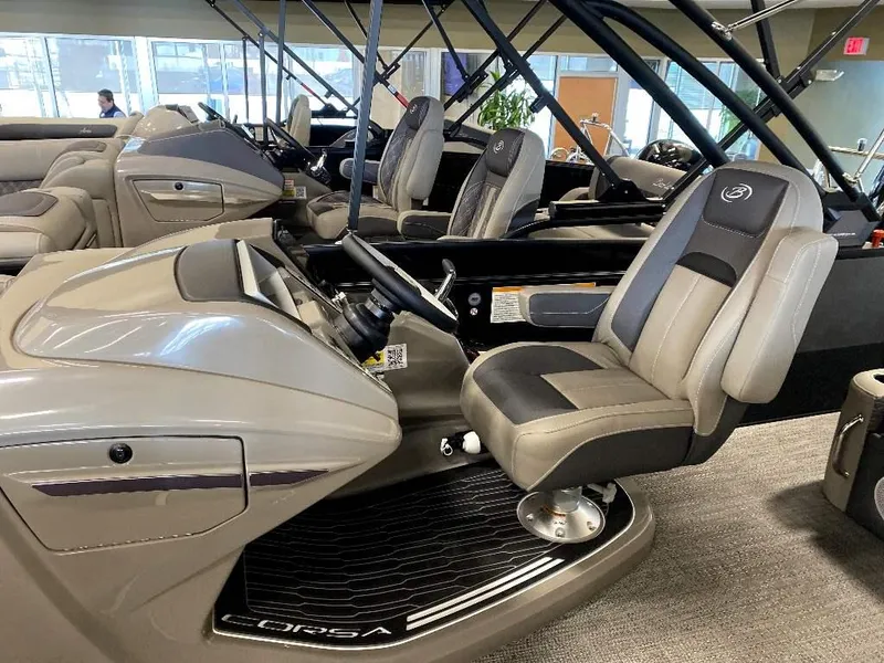 Slide: The Image of 2024 Barletta Corsa Ultra-Lounge 23UCA boat interior with captain's chair and dashboard. - 10