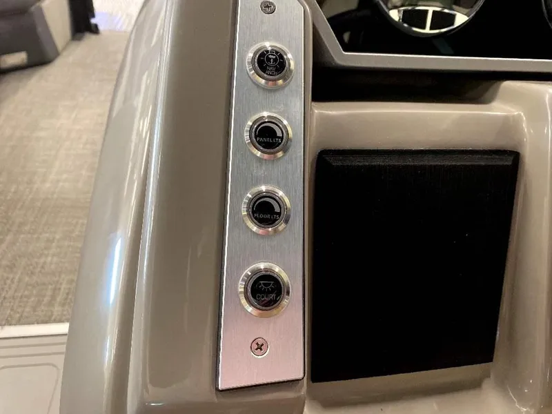 Slide: The Image of 2024 Barletta Corsa Ultra-Lounge 23UCA control panel with buttons and speaker. - 20