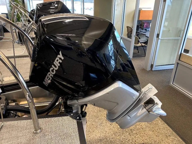 Slide: The Image of 2024 Barletta Corsa Ultra-Lounge 23UCA with Mercury outboard motor in showroom. - 24