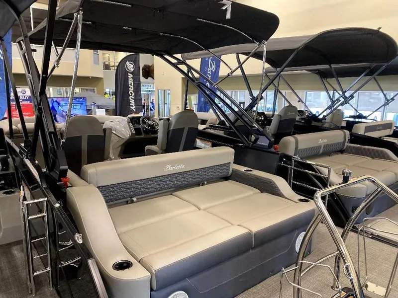 Slide: The Image of 2024 Barletta Corsa Ultra-Lounge 23UCA pontoon boat interior at a showroom. - 4