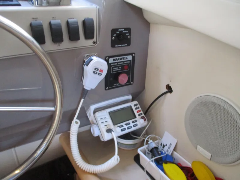Slide: The Image of Control panel of a 1997 Carver Voyager boat with radio and speaker. - 22
