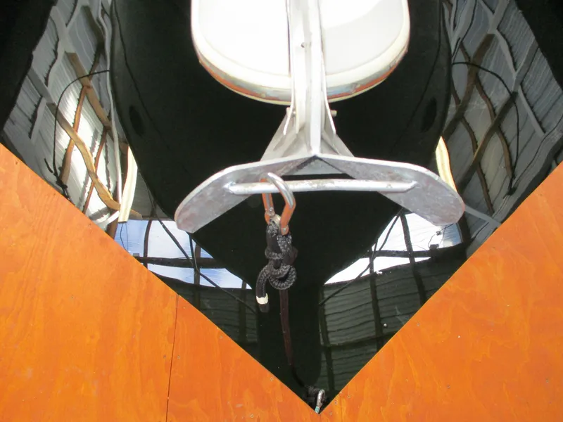 Slide: The Image of 1997 Carver Voyager boat anchor in a marina setting. - 6