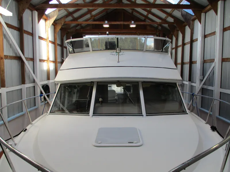 Slide: The Image of 1997 Carver Voyager yacht docked in a covered boathouse. - 2
