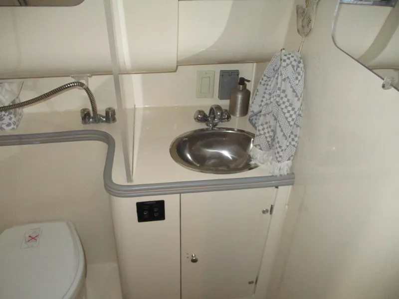 Slide: The Image of 1997 Carver Voyager bathroom with sink, faucet, and toilet in compact layout. - 37