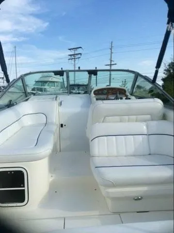 Slide: The Image of 1996 Sea Ray 270 Sundancer Special Edition boat interior with white seating and control panel. - 2