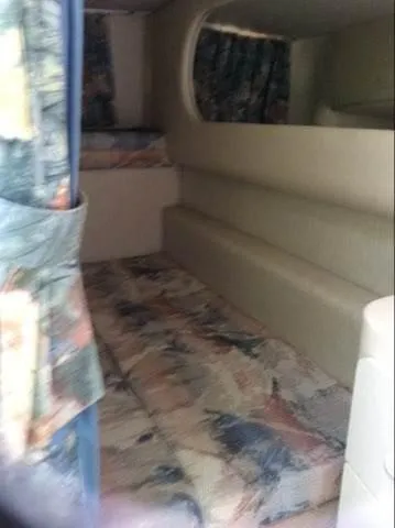 Slide: The Image of 1996 Sea Ray 270 Sundancer Special Edition cabin interior with patterned upholstery. - 5