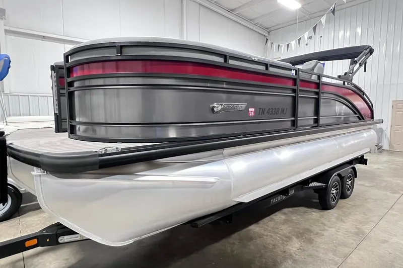 The Image of 2024 Harris Solstice 230 pontoon boat in showroom, featuring sleek design and modern amenities. - 0