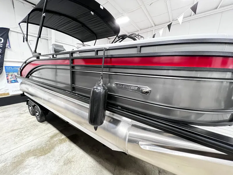 Slide: The Image of 2024 Harris Solstice 230 pontoon boat in showroom. - 12
