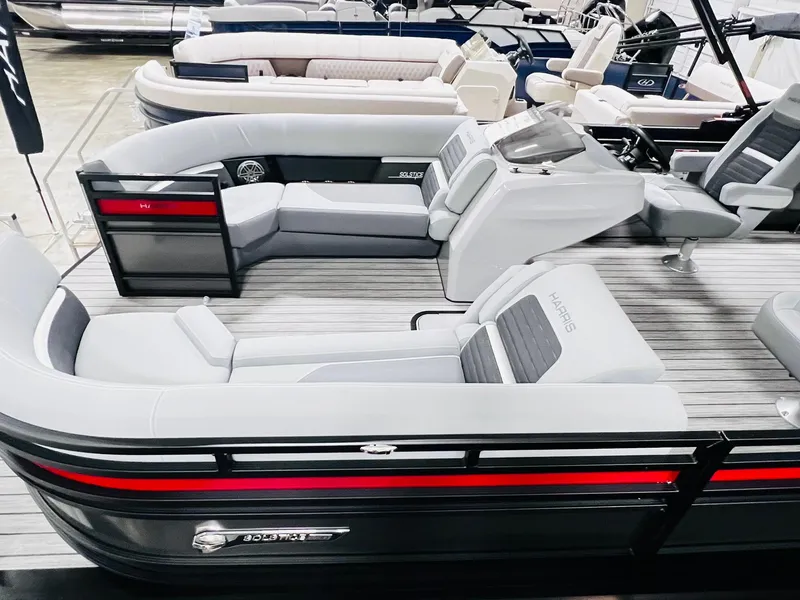Slide: The Image of 2024 Harris Solstice 230 pontoon boat with luxurious seating and modern design. - 16
