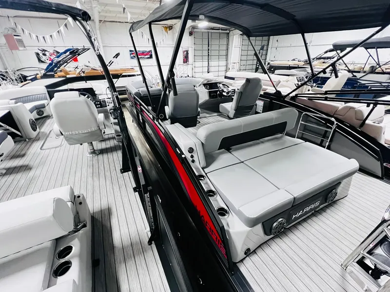 Slide: The Image of 2024 Harris Solstice 230 pontoon boat interior with seating and canopy. - 17
