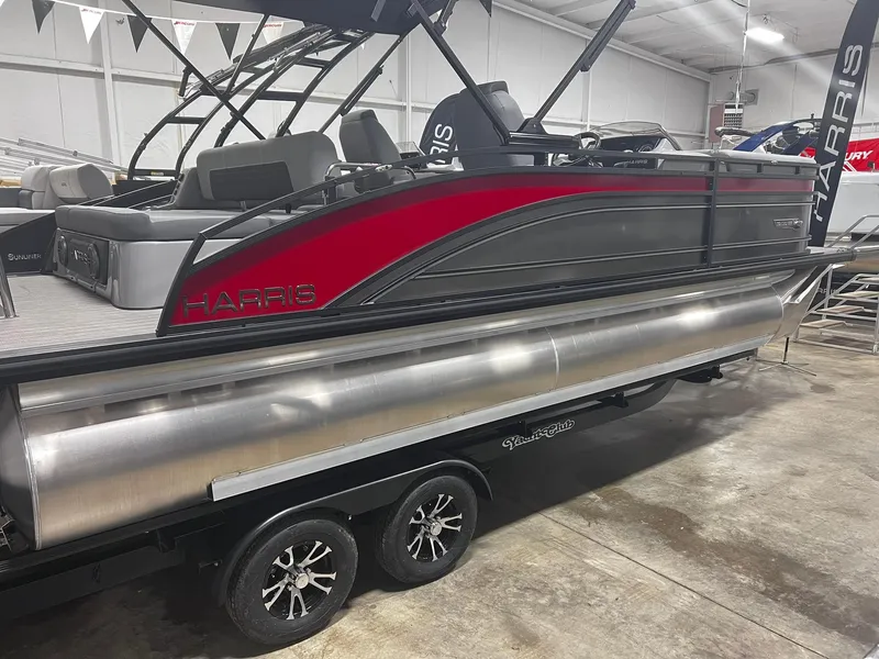Slide: The Image of 2024 Harris Solstice 230 pontoon boat in showroom, side view. - 20