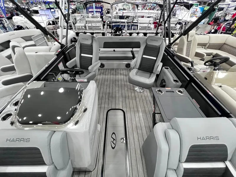 Slide: The Image of 2024 Harris Solstice 230 pontoon boat interior with luxurious seating and modern amenities. - 21