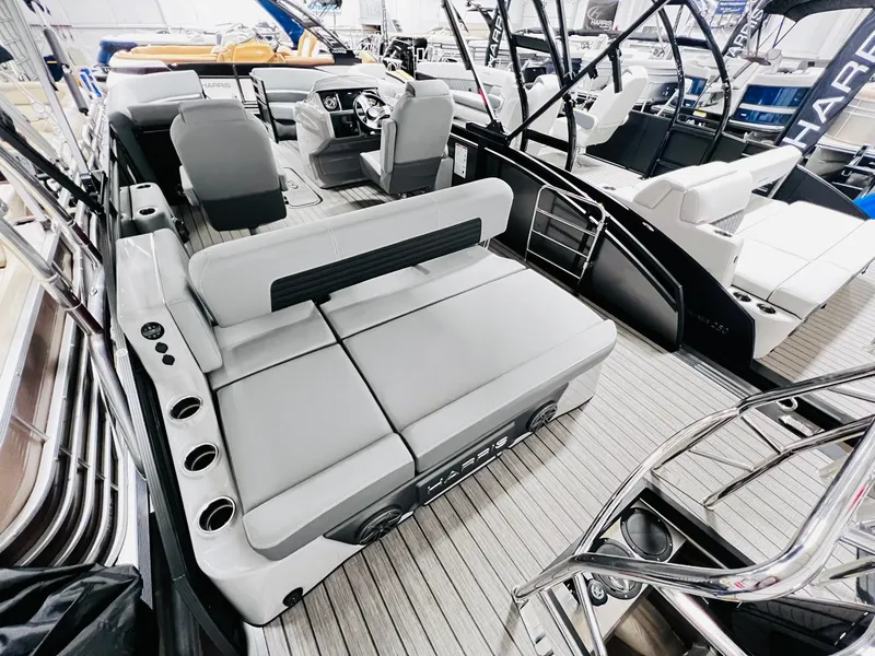 Slide: The Image of 2024 Harris Solstice 230 pontoon boat interior with luxurious seating and modern design. - 22