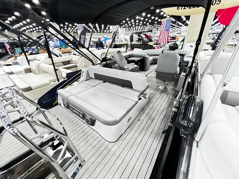 Slide: The Image of 2024 Harris Solstice 230 pontoon boat interior at a boat show. - 23