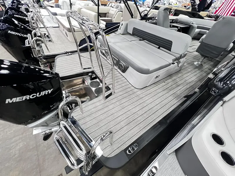 Slide: The Image of 2024 Harris Solstice 230 pontoon boat with Mercury outboard engines and spacious seating. - 24