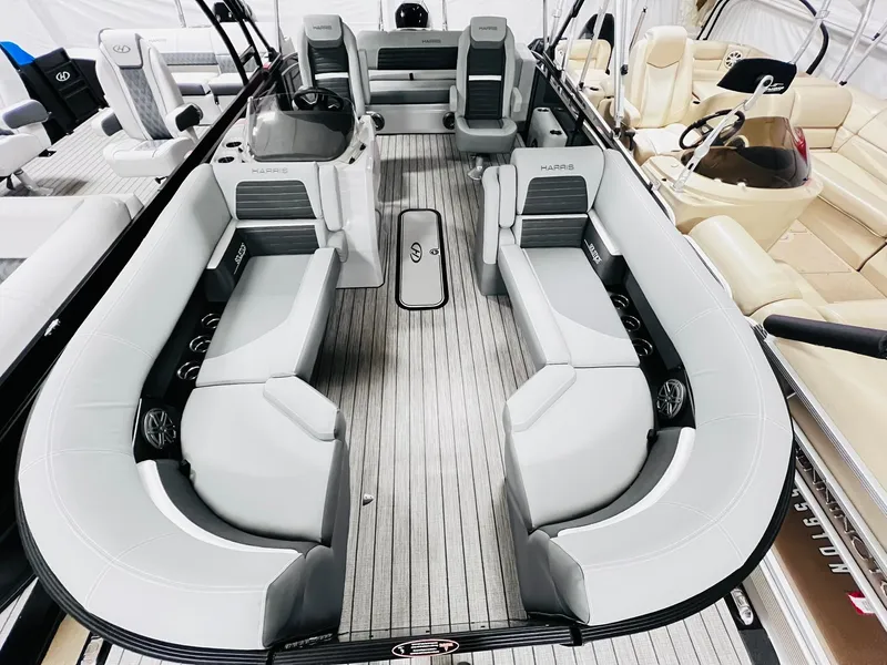 Slide: The Image of 2024 Harris Solstice 230 pontoon boat with spacious seating and modern design. - 26