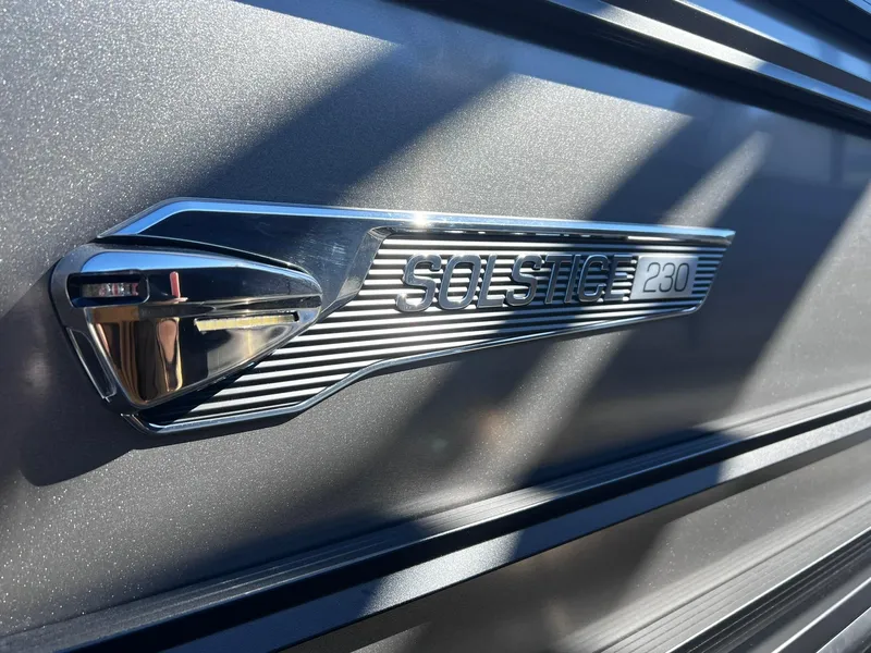 Slide: The Image of 2024 Harris Solstice 230 boat emblem in sunlight. - 33