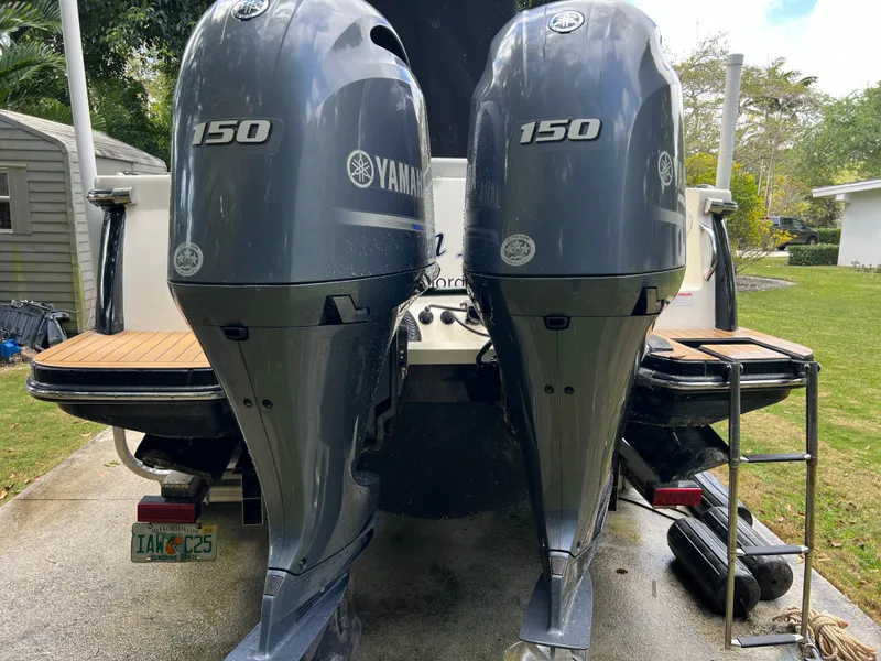 Slide: The Image of 2019 Scout 255LXF boat with twin Yamaha 150 outboard engines. - 26