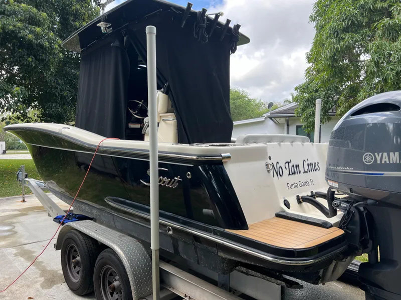 Slide: The Image of 2019 Scout 255LXF boat on trailer with Yamaha outboard motor. - 29