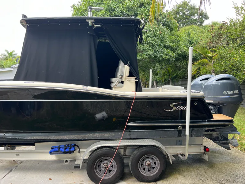 Slide: The Image of 2019 Scout 255LXF boat on trailer with Yamaha outboard motors. - 31