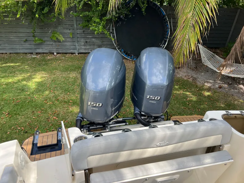 Slide: The Image of 2019 Scout 255LXF boat with twin Yamaha 150 outboard engines. - 33