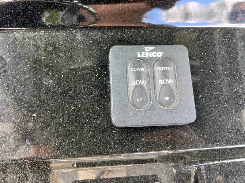 Slide: The Image of Lenco trim tab control panel on a 2019 Scout 255LXF boat. - 47
