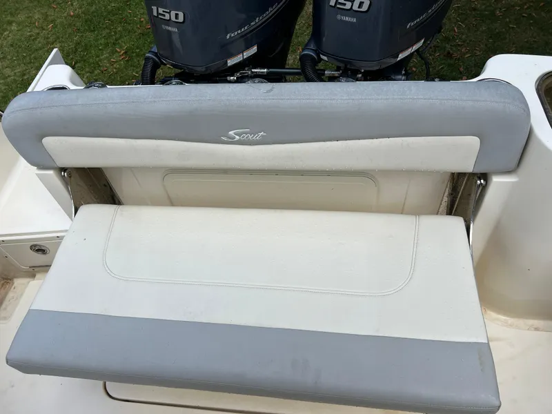 Slide: The Image of 2019 Scout 255LXF boat with dual Yamaha 150 engines and cushioned seating. - 48