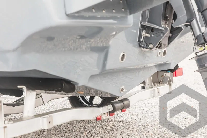 Slide: The Image of 2023 Tidewater 1910 Bay Max boat on trailer, close-up of hull and engine. - 12